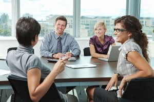 6285993 - group of young business people talking on business meeting at office.