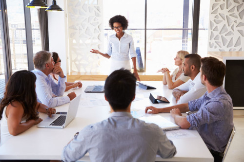 41402371 - businesswoman presenting to colleagues at a meeting